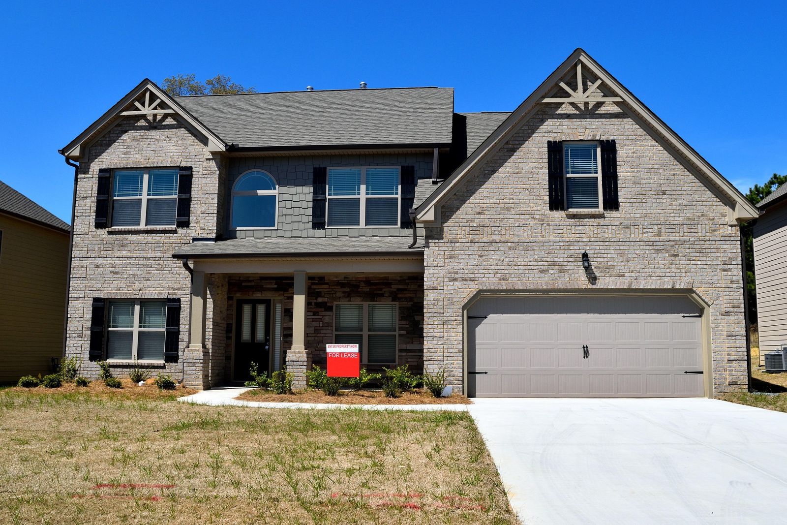 A two-story brick house with a 
